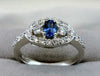HALO SETTING DIAMOND AND BLUE SAPPHIRE ENGAGEMENT RING