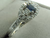 HALO SETTING DIAMOND AND BLUE SAPPHIRE ENGAGEMENT RING