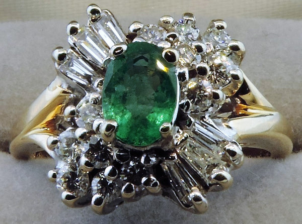 OVAL EMERALD AND DIAMOND CELEBRATION CLUSTER RING