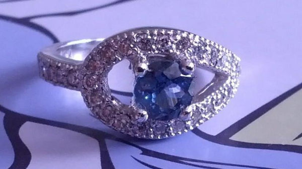 DIAMOND AND BLUE SAPPHIRE ENGAGEMENT RING