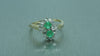 DOUBLE CLUSTER DIAMOND AND EMERALD RING