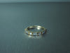 HALF ETERNITY DIAMOND RING WITH ROUND BRILLIANT AND BAGUETTE DIAMONDS