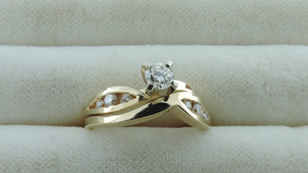 SWIRL CHANNEL ENGAGEMENT AND WEDDING RING SET